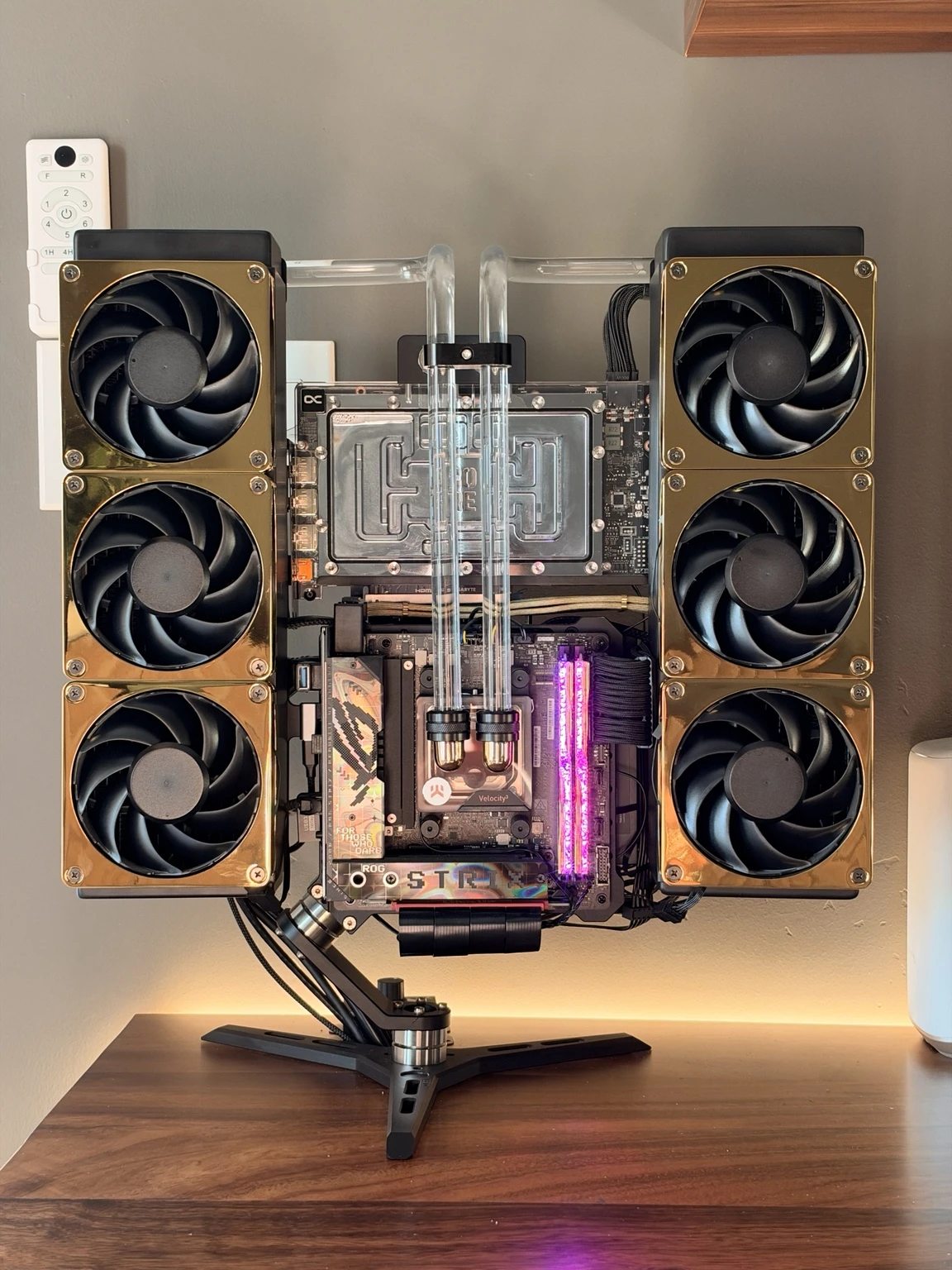 Black and gold 5090 Showcase with custom GPU mounting, gold fans, and hard tubing